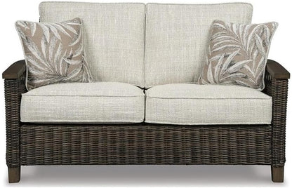 Upgrade Your Outdoor Space with the Signature Design by Ashley Brown Paradise Trail Round Wicker Fire Pit Table